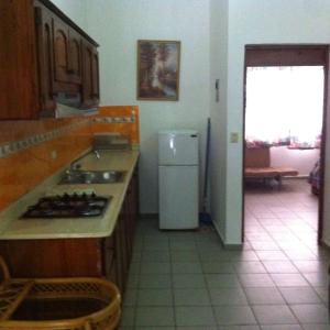 Kuchyň nebo kuchyňský kout v ubytování Residencial Estephany