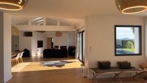 a living room with a couch and a table at Villa Haizea proche Bidart in Ahetze