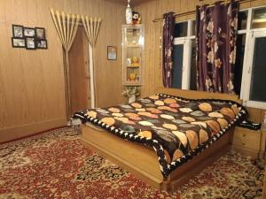 a bedroom with a bed in a room at Bunk Home stay in Srinagar