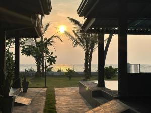 a sunset over the ocean from a villa at Tuktuk Cabanas in Negombo