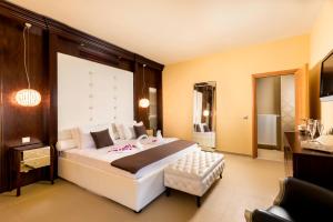 a bedroom with a large white bed in a room at Lindos Villa Estelle in Líndos +41 photos