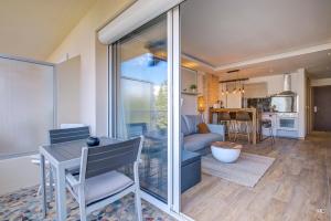 a living room with a couch and a table at WIlson Palace - Studio avec terrasse et climatisation in Antibes +25 photos