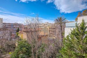 a view of a city with trees and buildings at WIlson Palace - Studio avec terrasse et climatisation in Antibes