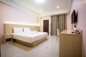 Postel nebo postele na pokoji v ubytování Unity Hotel