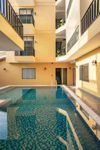 a swimming pool in the middle of a building at Lumi Hội An Hotel in Hoi An