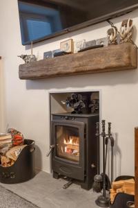 a fireplace in a living room with a fire in it at Ramsay Lane in Lossiemouth