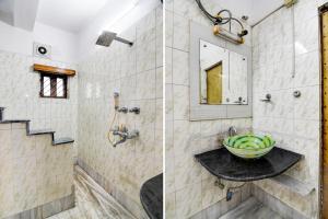 a bathroom with a sink and a mirror at Hotel O Avenue Villa in Dum Dum