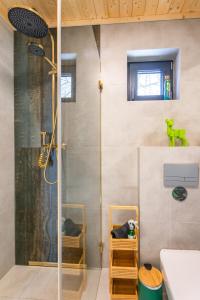 a bathroom with a shower and a sink at Hytte pod Karpaczem in Miłków +18 photos