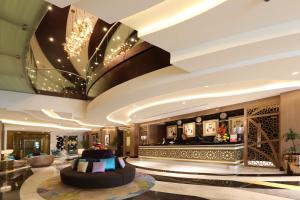 a lobby of a hotel with a large lobby at Samaya Hotel Deira in Dubai