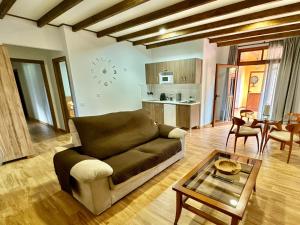 a living room with a couch and a table at Villa El Guanche -Boutique Apartments & rooms in Gáldar