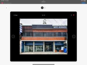a tablet screen of a building with a store at Natos Residences - Gonzaga in Bacolod