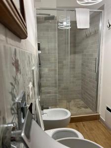 a bathroom with a shower and a toilet and a sink at le Piagge in Viterbo +23 photos