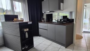 a kitchen with a sink and a counter top at Moderne Gästesuite in Lucerne