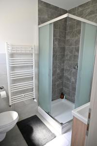 a shower with a glass door in a bathroom at Sobe i apartmani MILLA in Slavonski Brod +48 photos