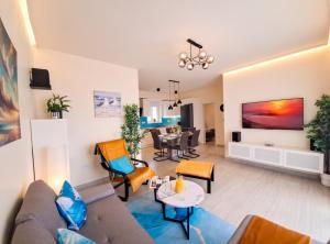 a living room with a couch and a table at Villa TeSa in Sevid