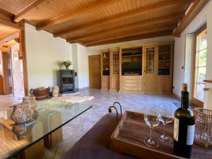 a living room with a glass table and wine glasses at Auszeit Ferienhaus Nr 2 und 2a in Sierscheid +45 photos