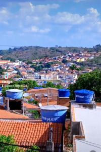a view of a city with blue containers on roofs at Flets Triunfo-PE in Triunfo +4 photos