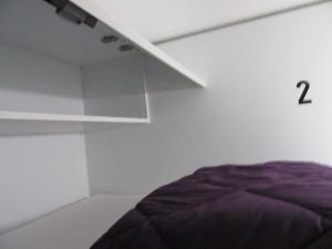 a room with a bed and a window at Hostel Casa Ibarrola in Pamplona