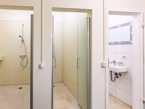 a bathroom with a shower and a sink at Attic apartment in villa! in Berlin