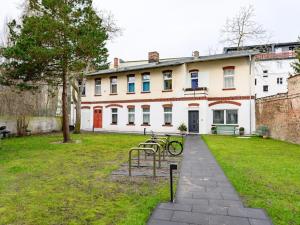 a building with two bikes parked in front of it at Attic apartment in villa! in Berlin