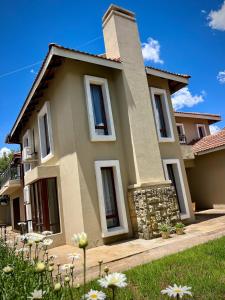 a house with a garden in front of it at Thetsane Ridge in Maseru
