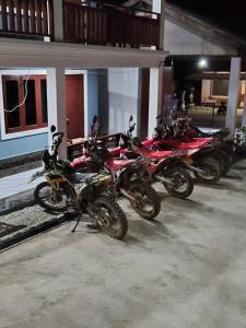a row of motorcycles parked next to a building at Keomisay in Nongkhiaw