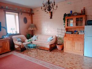 a living room with a couch and a table at ZŁOTY BUK in Jagniątków