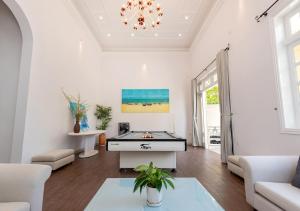 a living room with a pool table in it at AnNam Village 4 in Vung Tau