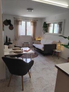 a living room with a couch and a table at Apartment CALISTROS BENITACHELL MINIMUM STAY ONE NIGHT in Benitachell +30 photos