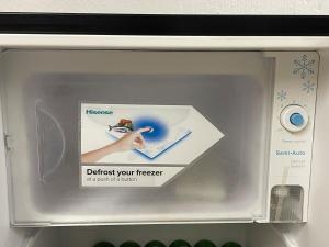 a door of a refrigerator with a sticker on it at Studio APT with pool and jacuzzi at the golf course in Johannesburg