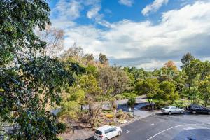 a parking lot with cars parked in a parking lot at Premium South Melb 2 Queens Study Pool & Gym in Melbourne