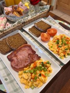a buffet of different types of food on plates at Edenmore Cottage Bed & Breakfast in Moorefield