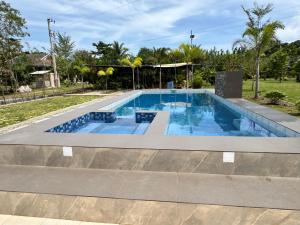 Kolam renang di atau di dekat INATO SUITES Rm 1 1 queen bed and a pullout sofa bed