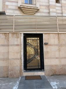 a door to a building with a gate at استديو المنام الراقي in Medina