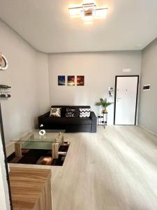 a living room with a couch and a table at Empoli Charm in Empoli +20 photos