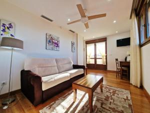 a living room with a couch and a table at Hotel Verdemar by Grupo A Cobijo in Lamadrid