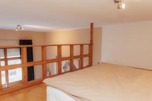a bedroom with a bed and a window at Seabreeze Suite in Füssen