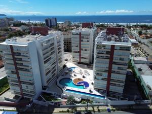 an aerial view of a city with tall buildings at Lar dos Santoprete I in Bertioga