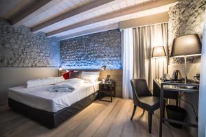 Posteľ alebo postele v izbe v ubytovaní Locanda al Vescovo & SPA + 37 fotografií