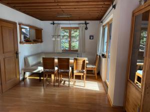 a dining room with a table and chairs at Ferienhaus Lengau in Saalbach-Hinterglemm