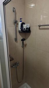 a shower in a bathroom with a shower at The Travellers Den in Matosinhos