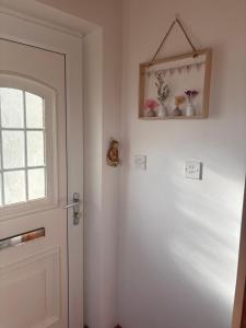 a door in a room with vases on the wall at Sonnys Rest in Ardara