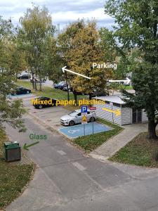a car parked in front of a parking lot at Apartament Prudniczanka in Prudnik