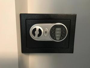 a wall outlet with a clock on the wall at Exclusive Modern Suite view in Kamloops