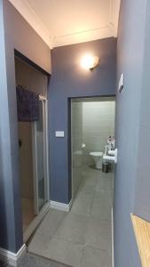 a bathroom with a shower and a toilet in it at The Serendipity Suite - A Scenic Countryside Hideaway in Letterkenny