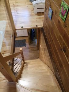 a view from the loft of a tiny house at Domek letniskowy Marksewo Łoś in Marksoby