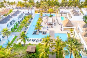 an aerial view of a resort with palm trees and a pool at Kalimba Beach Resort in Kotu