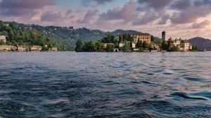 a large body of water with a town in the background at Stones and Pines in Rimella +20 photos