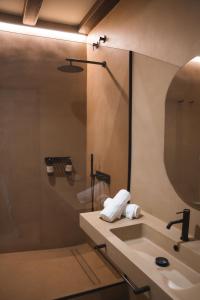 a bathroom with a sink and a mirror at Hotel Boutique Villa Emilia in Playa +55 photos