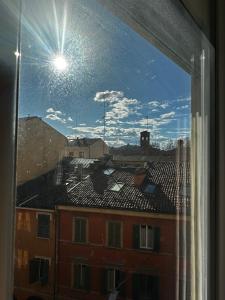 a window with a view of a building at SUITE LAME & stay comfy in Bologna